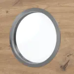 Detailansicht des Lichtausschnitts von WESTAG Doppelflügeltür Artis Eiche Cross EiC 793 Portalit CPL mit Lichtausschnitt Bullauge LA-KR 350 inkl. Zarge