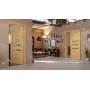 Main-Milieuansicht der vor Wand laufenden CLASSEN Schiebetür Greco M9 Eiche geölt 3D Look mit Lichtausschnitt